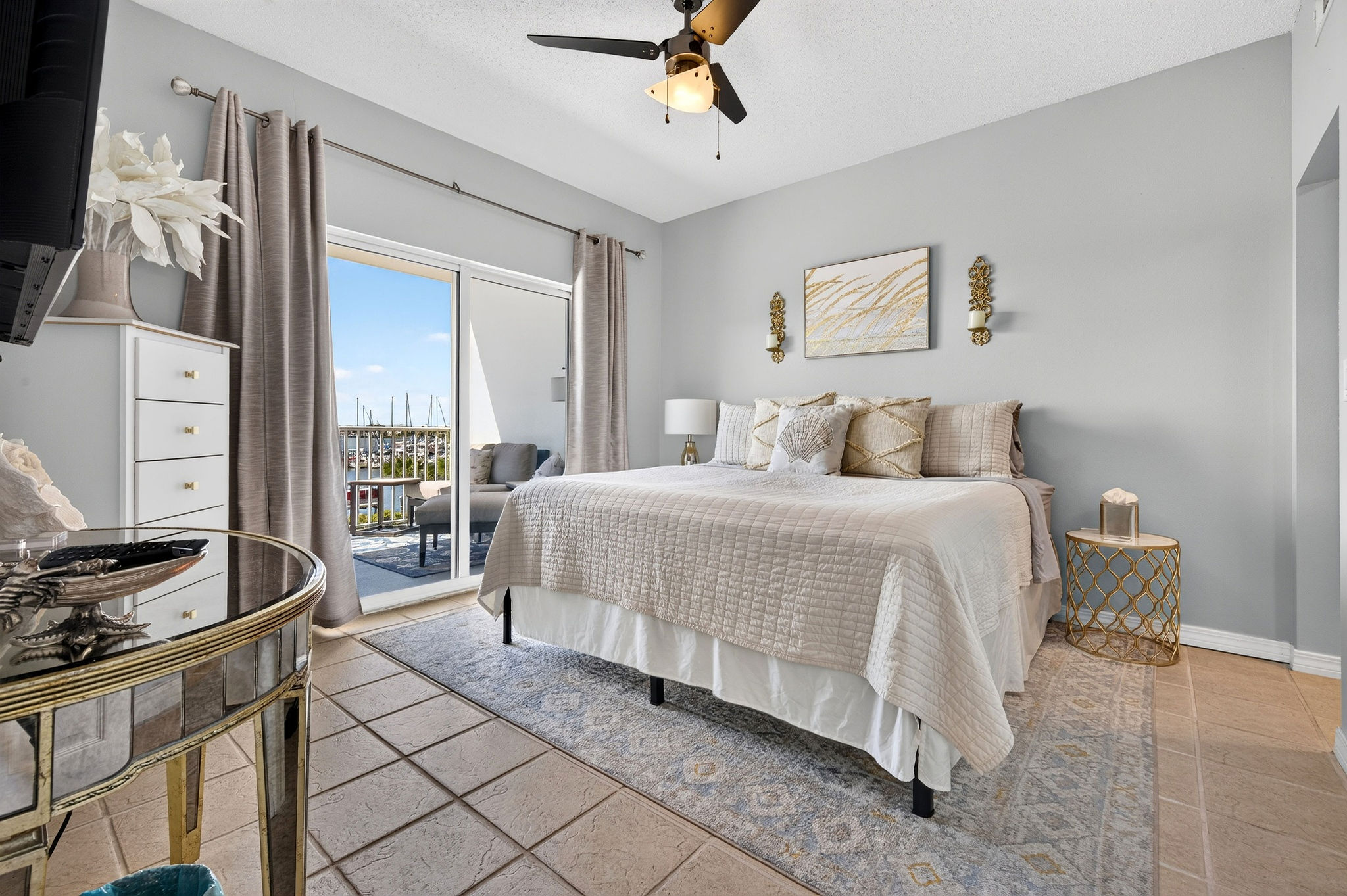 Primary bedroom · King bed and balcony access